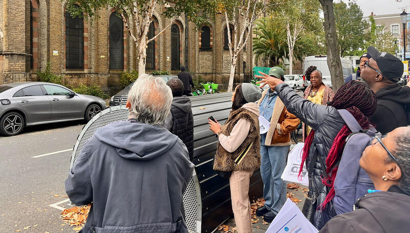 Walking group exploring Notting Hill streets