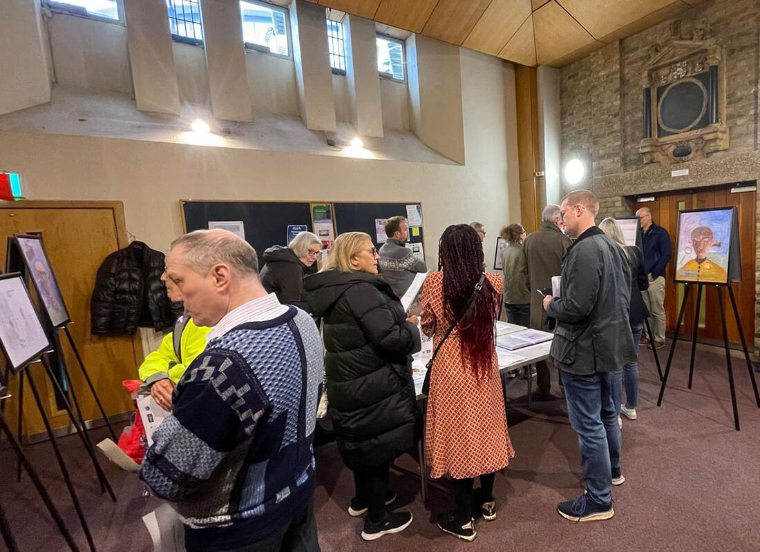 Written in the Records exhibition with visitors viewing student artwork